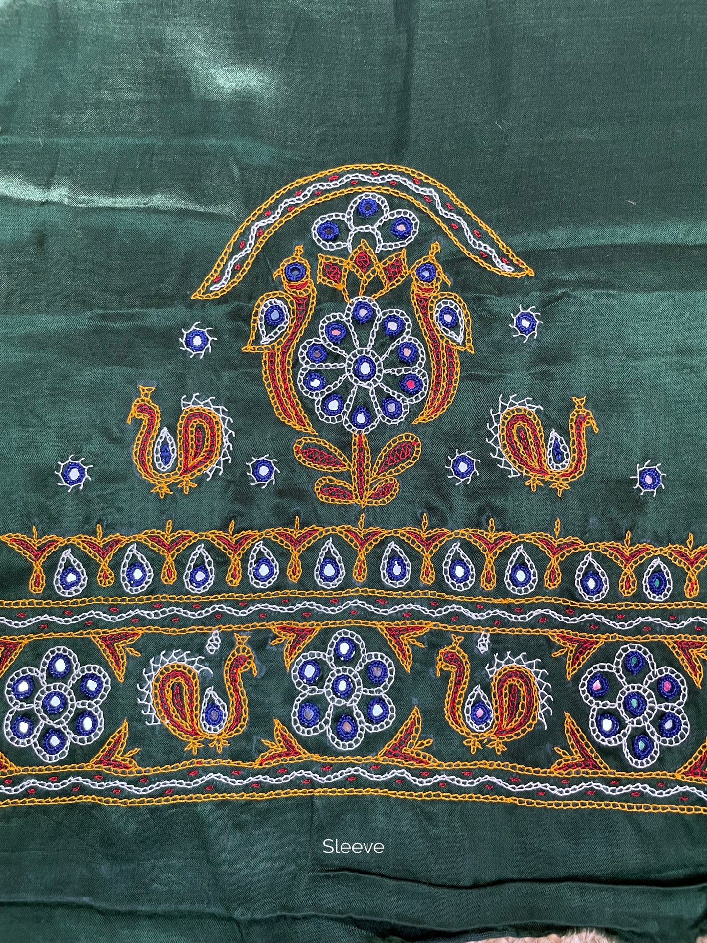 Bottle green Ahir embroidery blouse piece showcasing intricate handcrafted embroidery details
