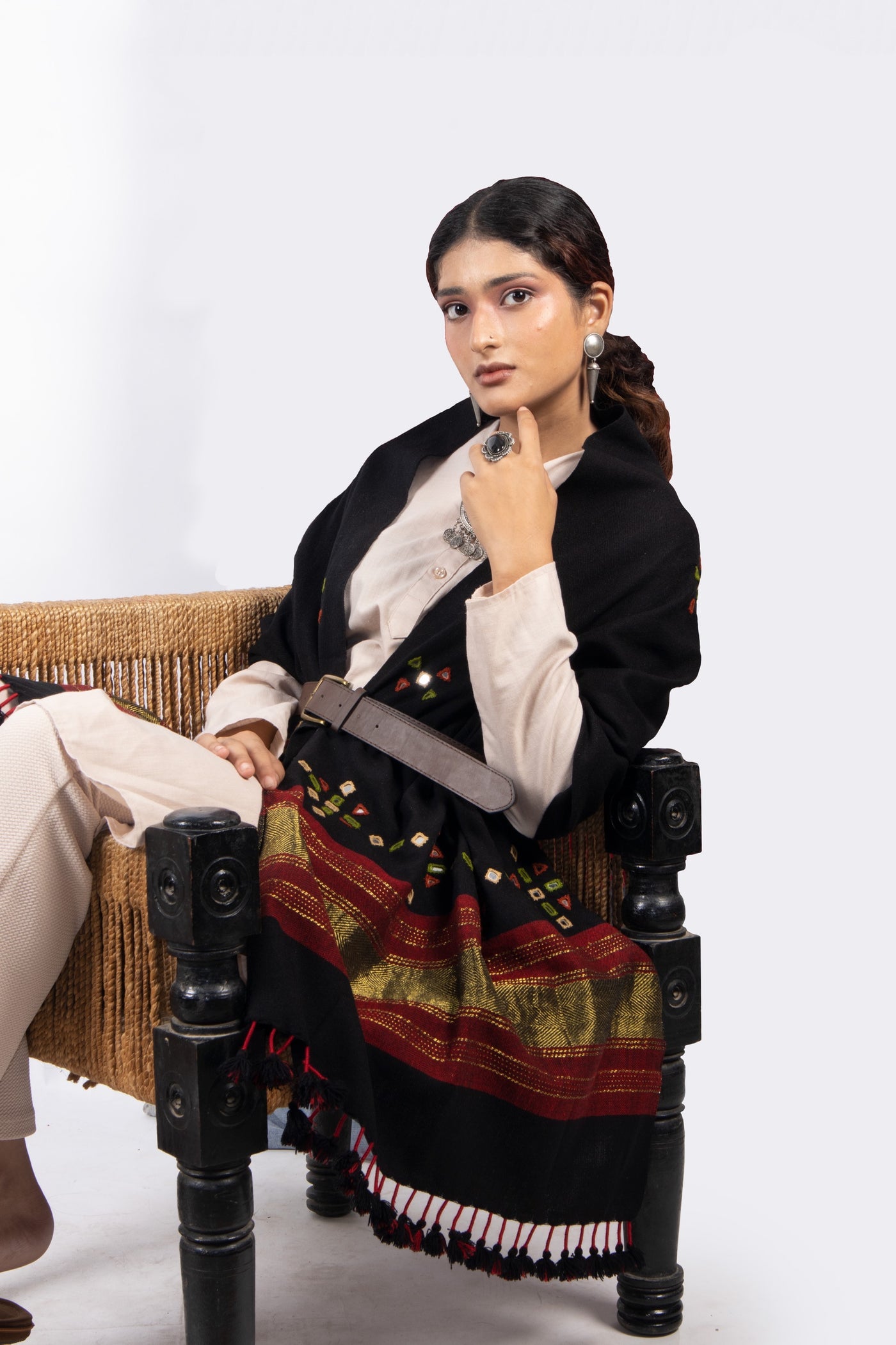 Premium handwoven woolen stole in classic black with a graceful drape and refined finish