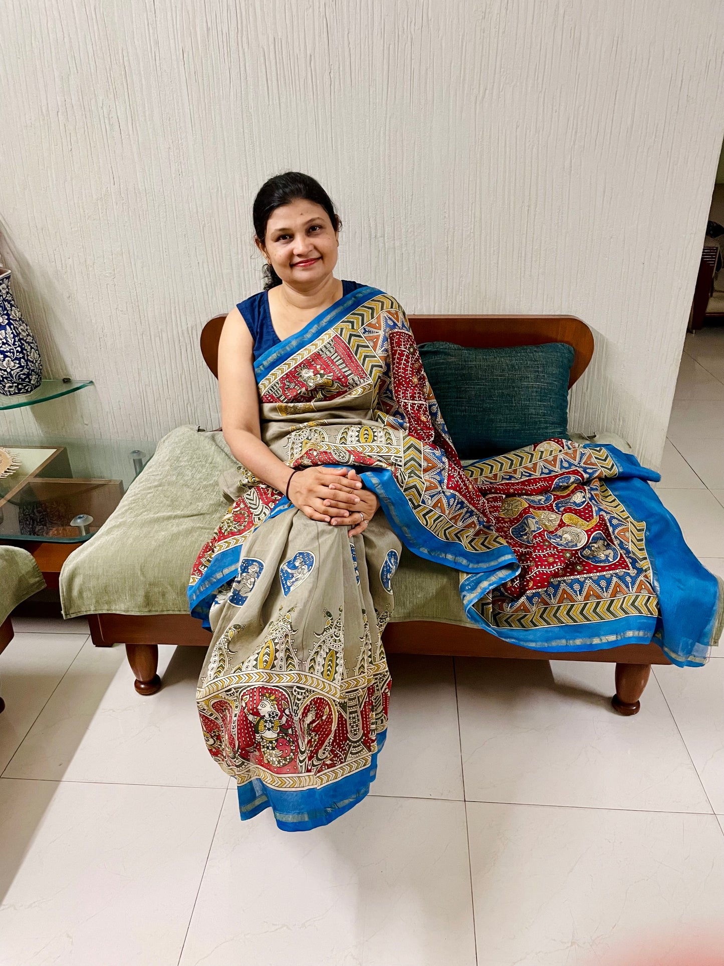 Handcrafted creamy red Mata Ni Pachedi saree adorned with authentic handpainted designs inspired by Gujarat's folk art heritage