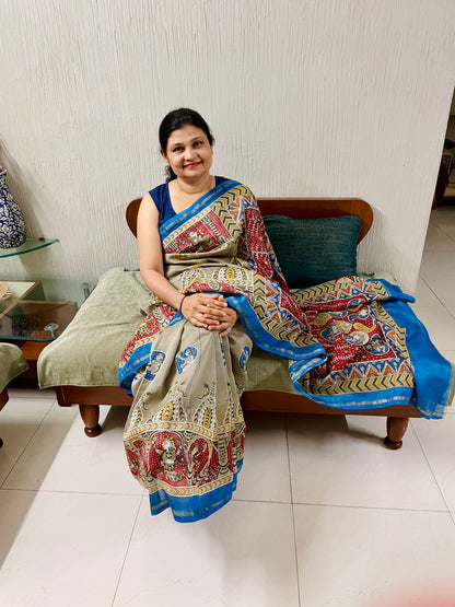Handcrafted creamy red Mata Ni Pachedi saree adorned with authentic handpainted designs inspired by Gujarat's folk art heritage