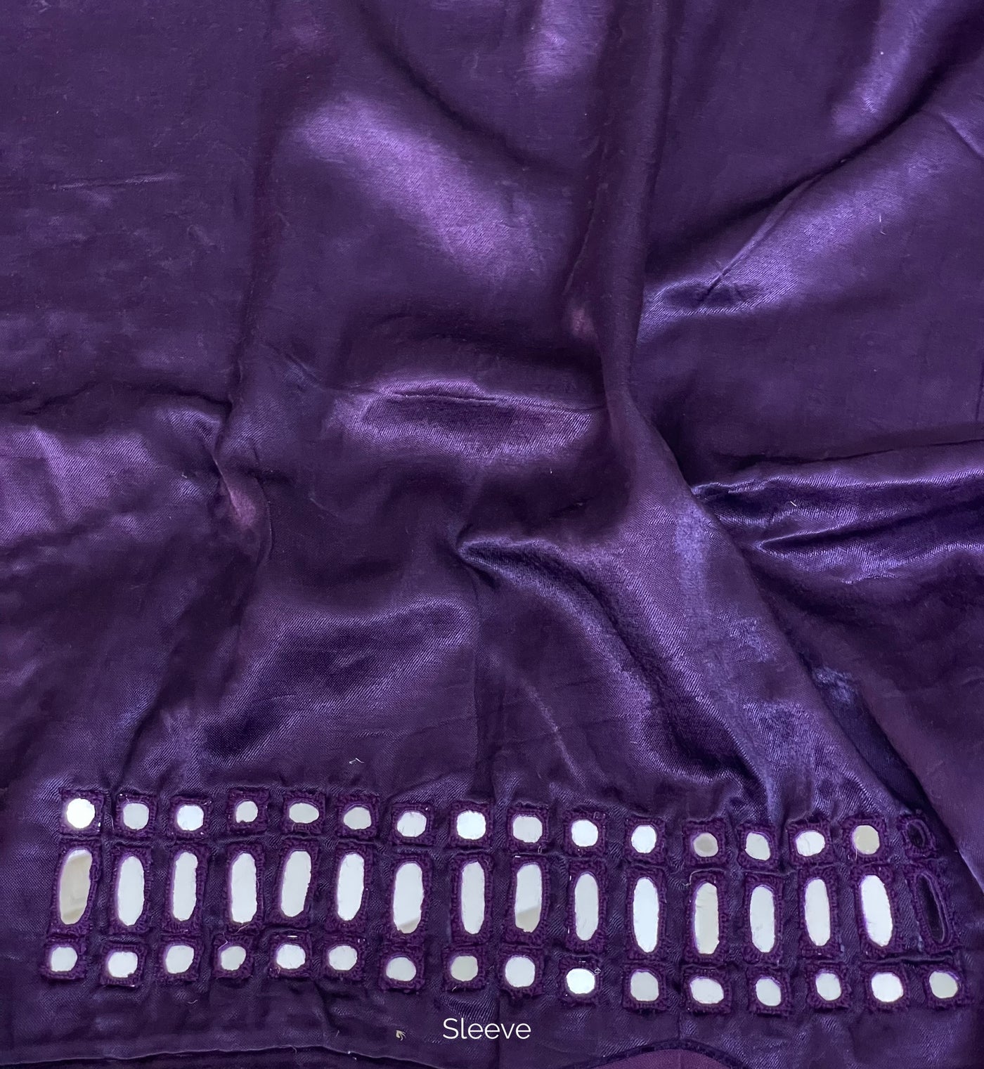 Deep violet mirror work blouse piece showcasing intricate handcrafted embellishments