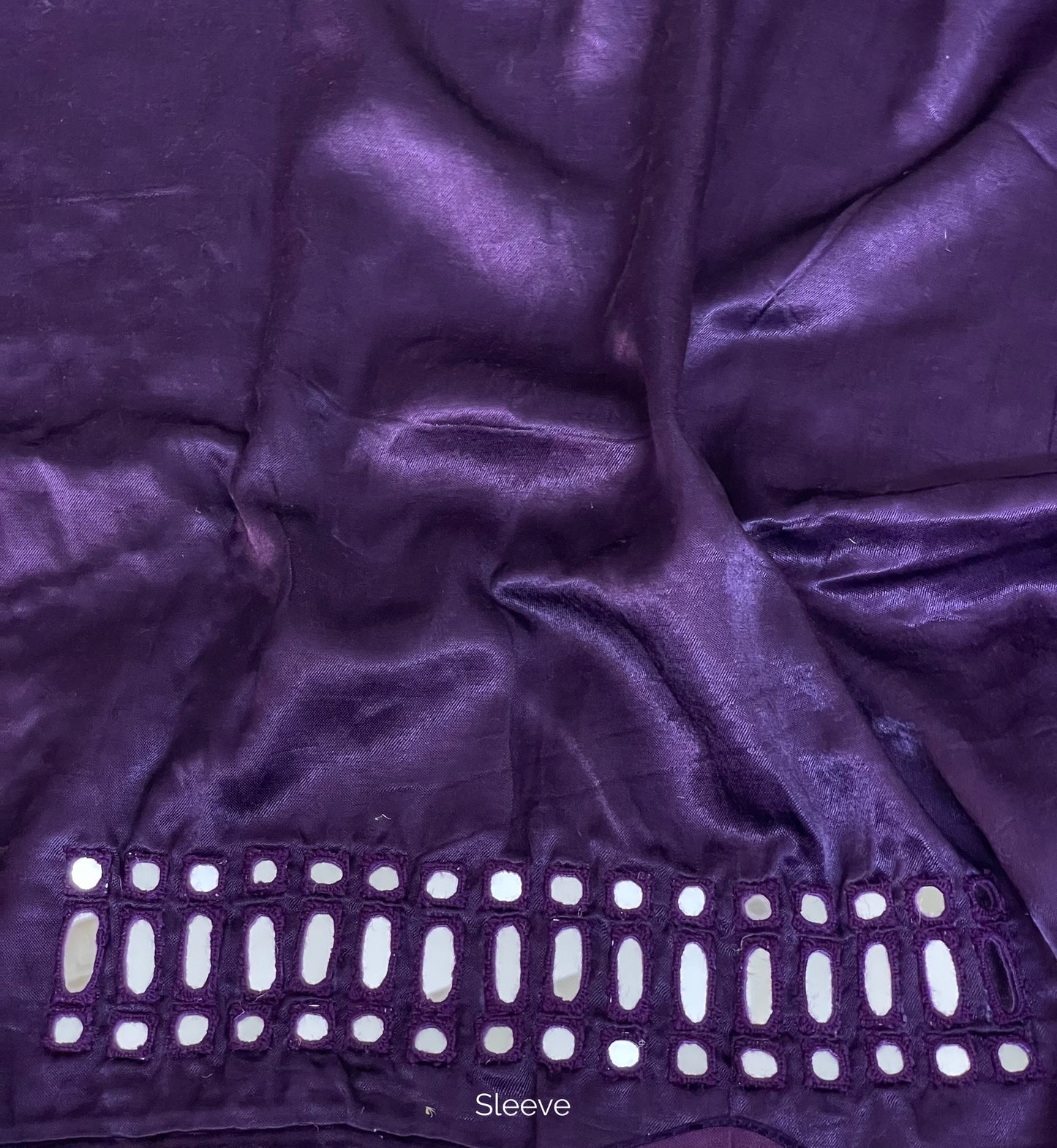 Deep violet mirror work blouse piece showcasing intricate handcrafted embellishments