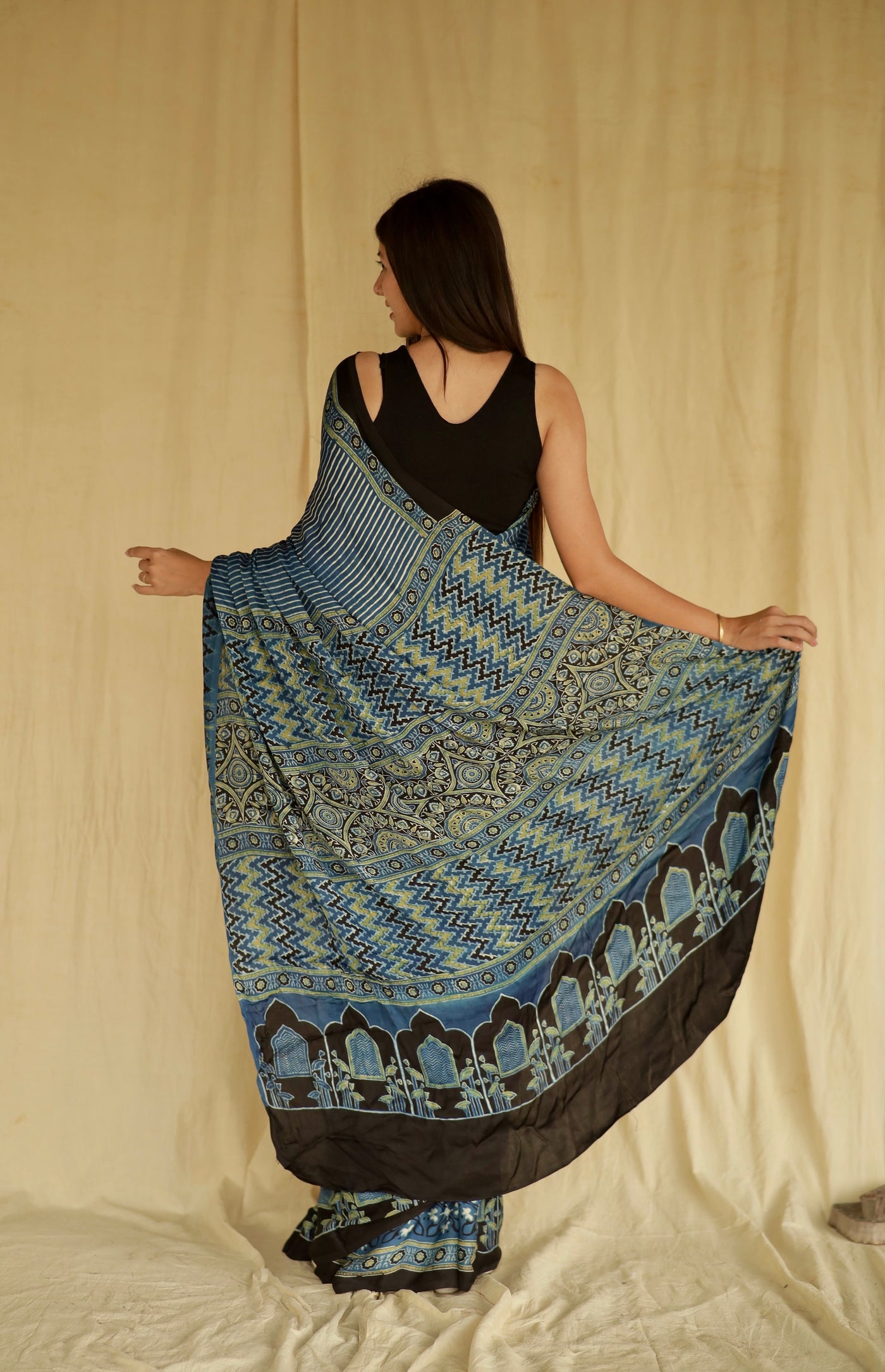 Premium denim blue modal silk saree with heritage-inspired Ajrakh designs and fluid texture