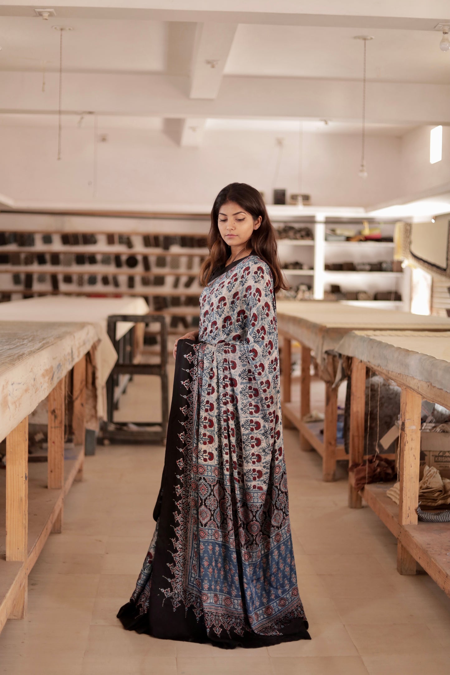 Premium dove grey modal silk saree with heritage-inspired Ajrakh designs and fluid texture