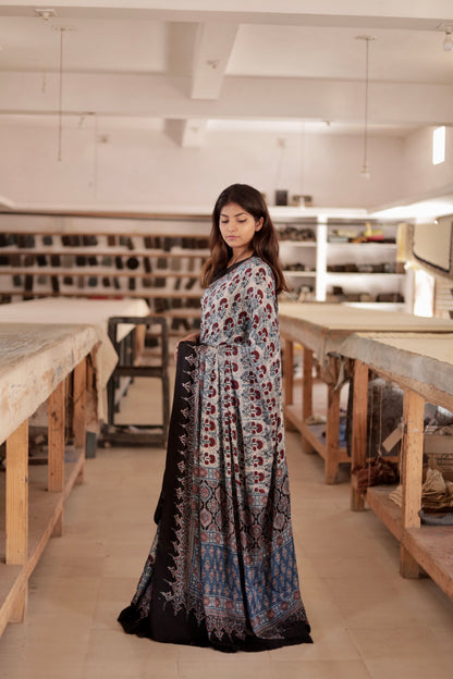 Premium dove grey modal silk saree with heritage-inspired Ajrakh designs and fluid texture