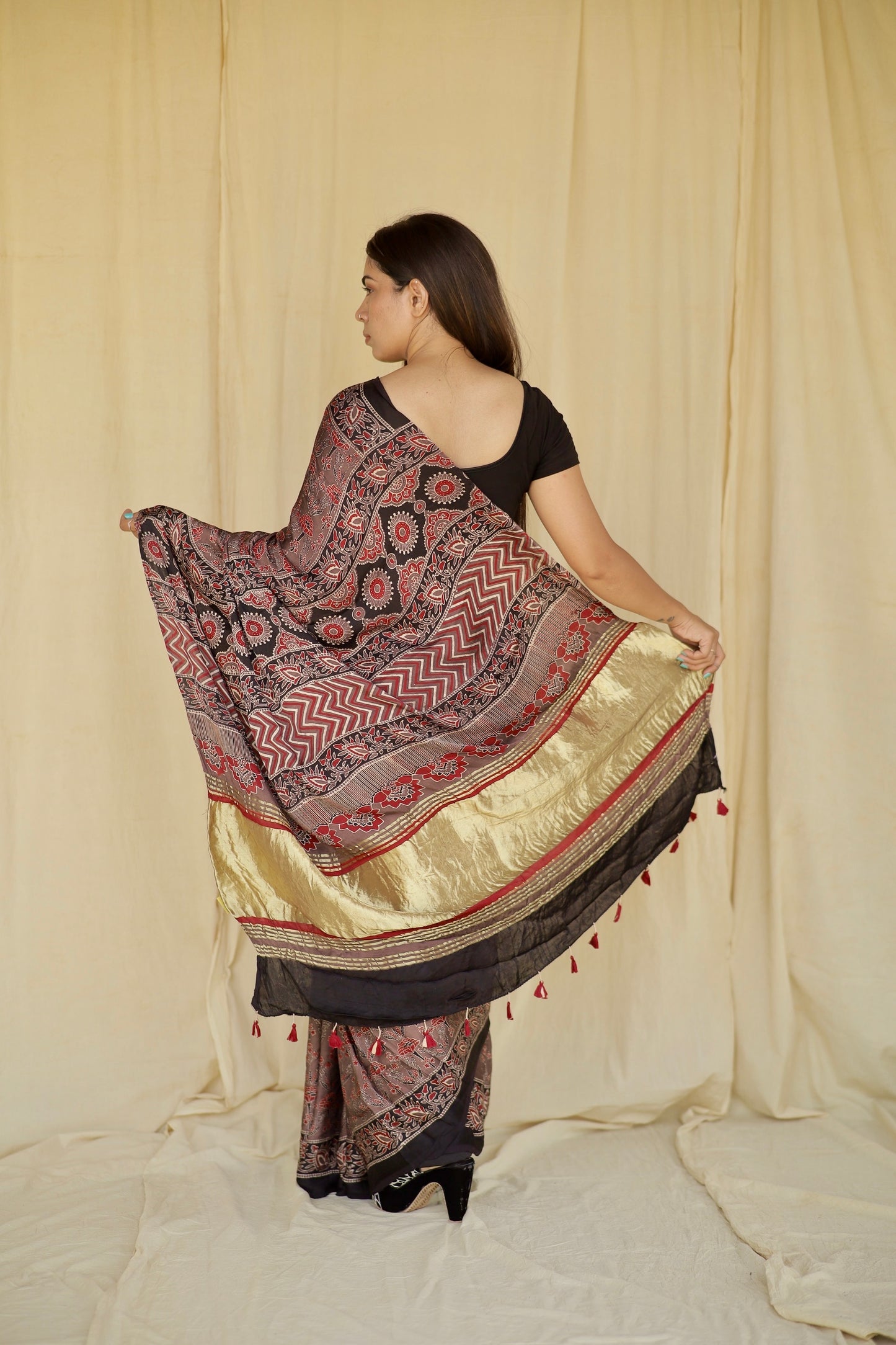 Premium dusty rose modal silk saree with heritage-inspired Ajrakh designs and fluid fall