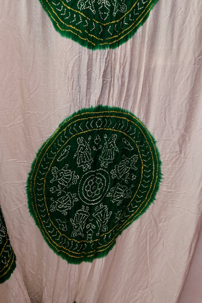 Handcrafted emerald Gajji silk saree showcasing authentic Bandhani artistry with rich zari detailing