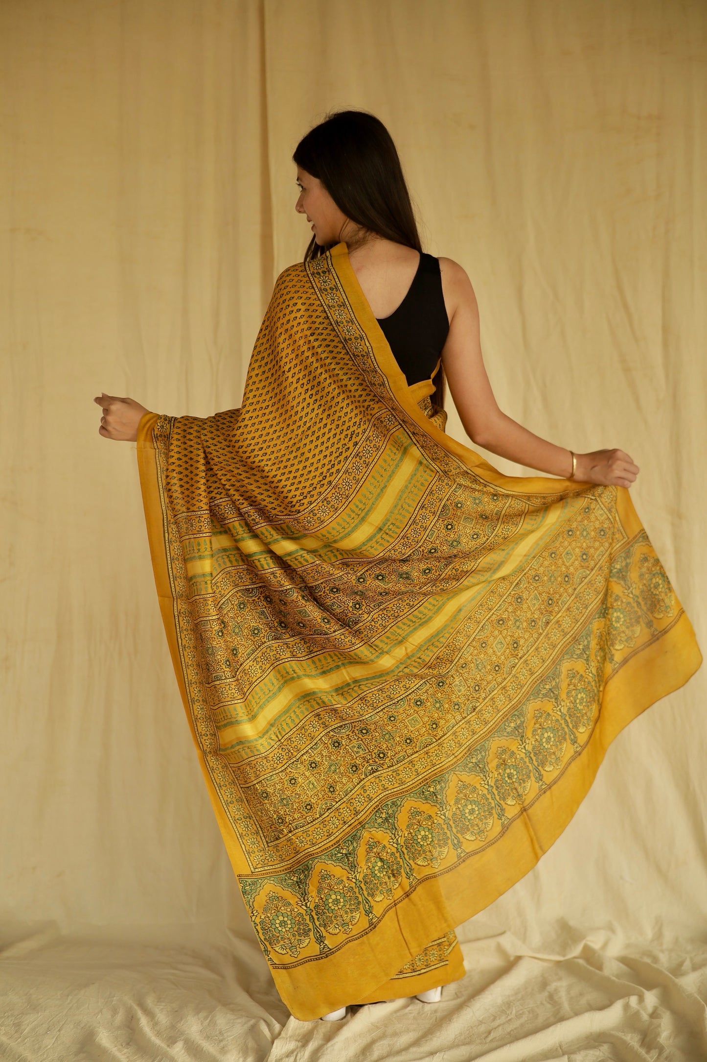 Premium golden mustard Chanderi silk saree with heritage-inspired Ajrakh designs and subtle sheen