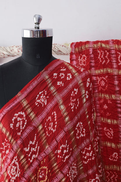 Elegant Bandhani Gharchola saree showcasing intricate tie-dye artistry and ceremonial elegance