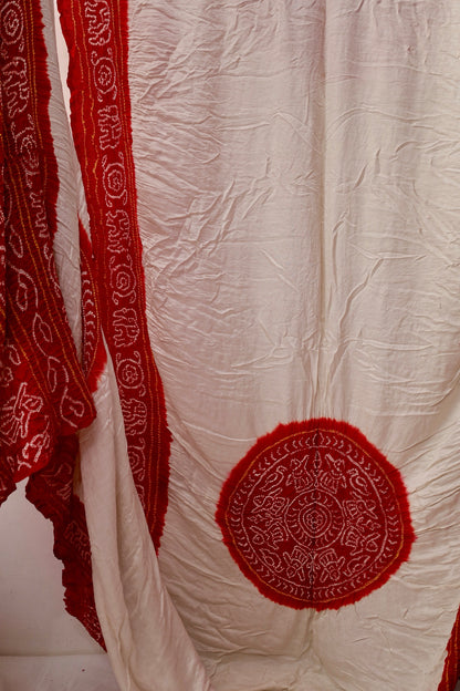 Handcrafted ivory red Gajji silk saree showcasing authentic Bandhani artistry with rich zari detailing