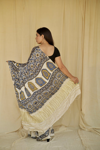 Ivory white modal silk saree with heritage-inspired Ajrakh designs and a soft flowing texture