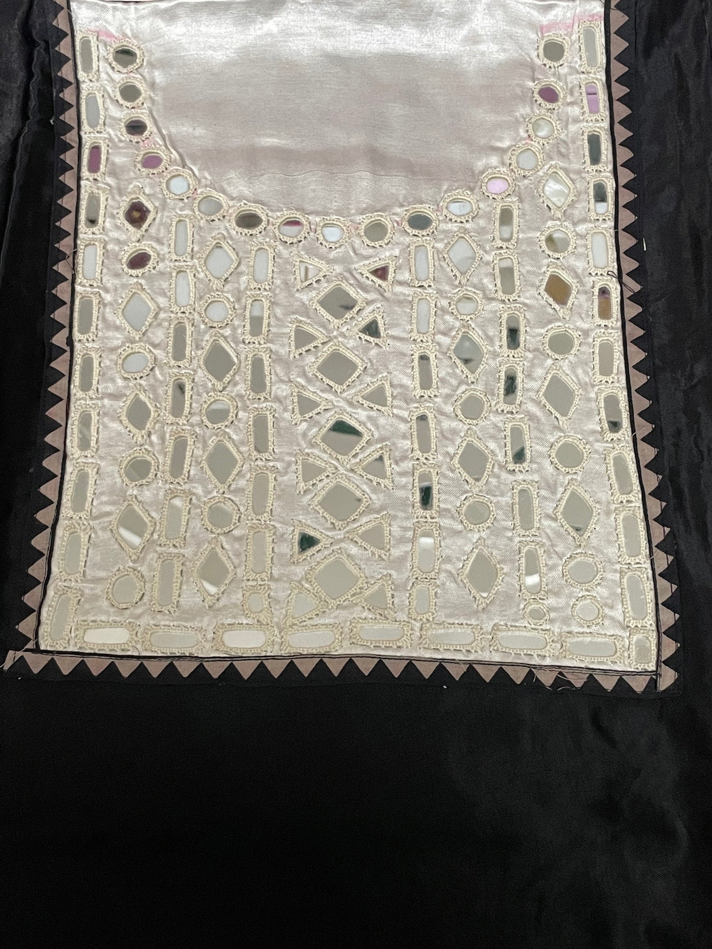 Jet black mirror work dress material showcasing intricate handcrafted embellishments