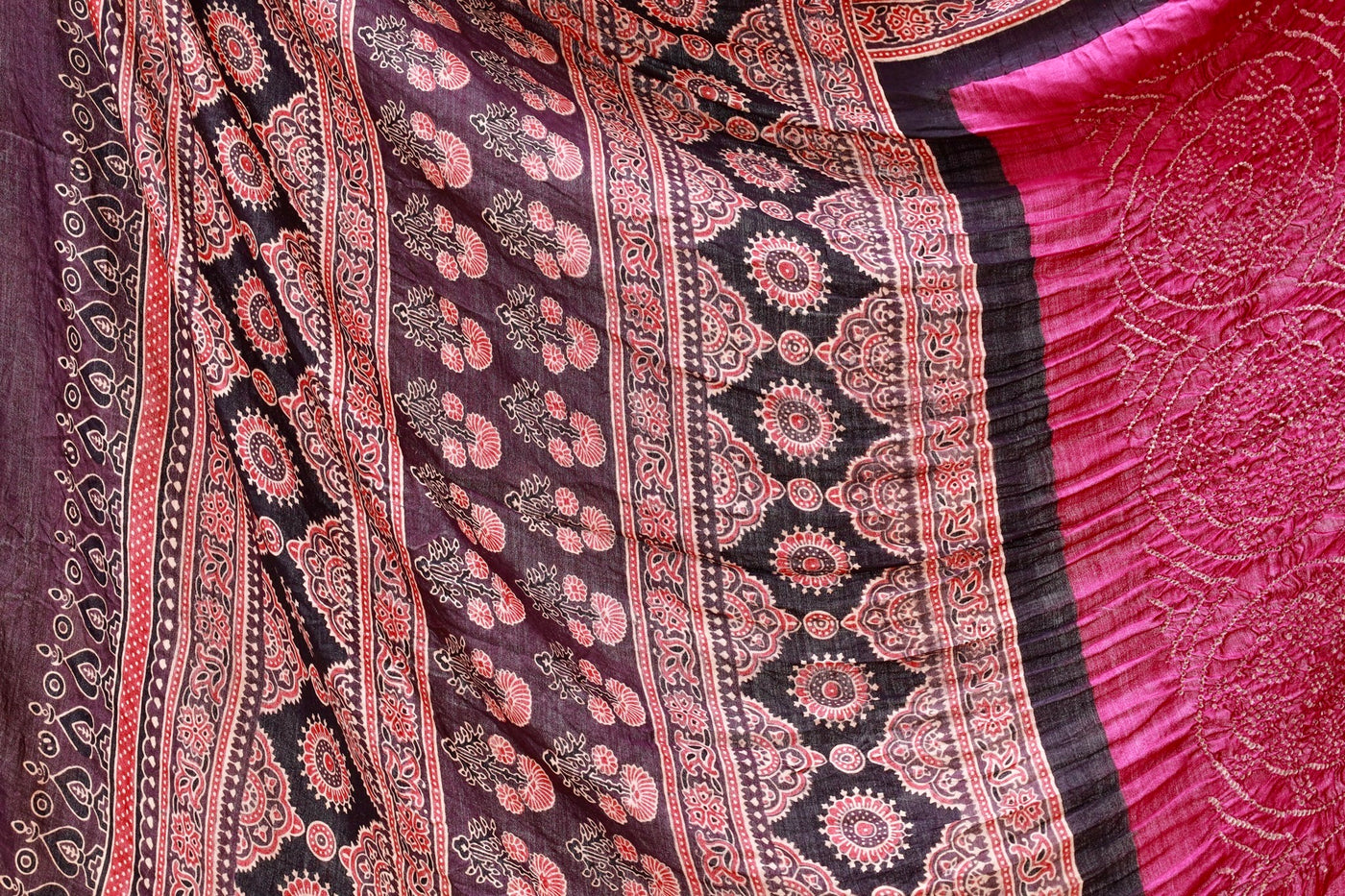 Handcrafted maroon silk saree showcasing authentic Ajrakh and Bandhani artisan craftsmanship