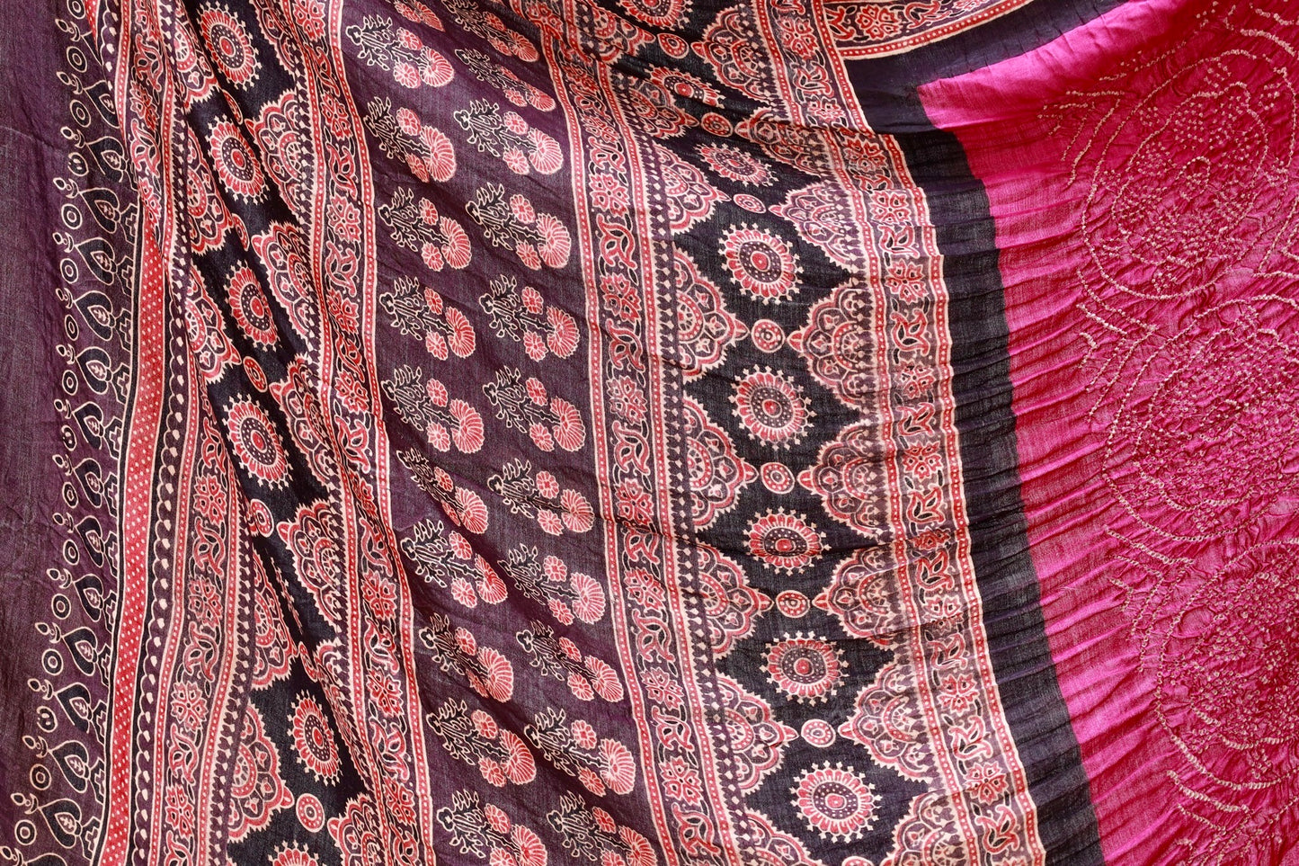 Handcrafted maroon silk saree showcasing authentic Ajrakh and Bandhani artisan craftsmanship