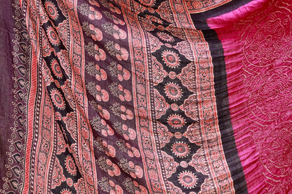 Handcrafted maroon silk saree showcasing authentic Ajrakh and Bandhani artisan craftsmanship