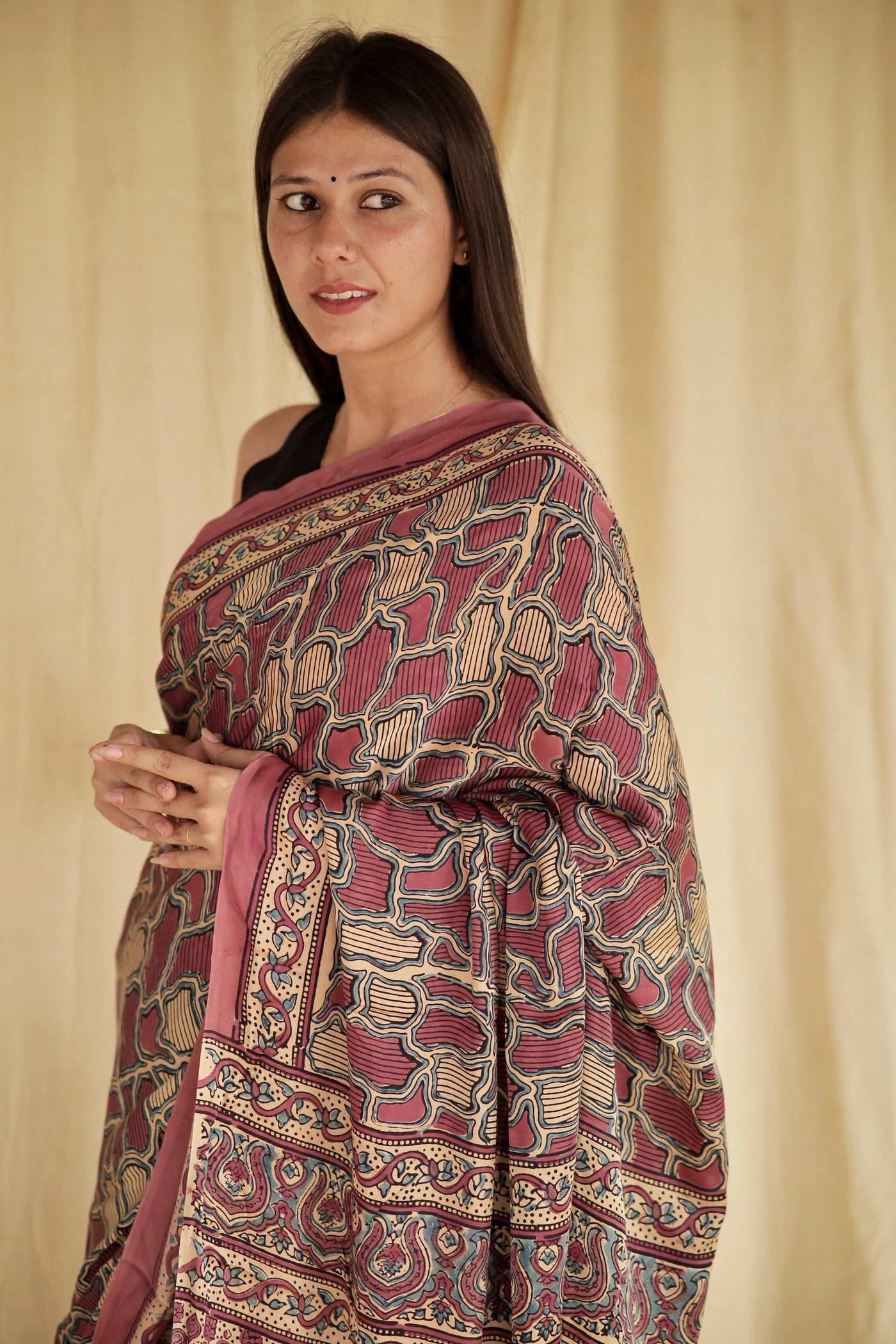 Premium mauve pink modal silk saree with heritage-inspired Ajrakh designs and fluid fall