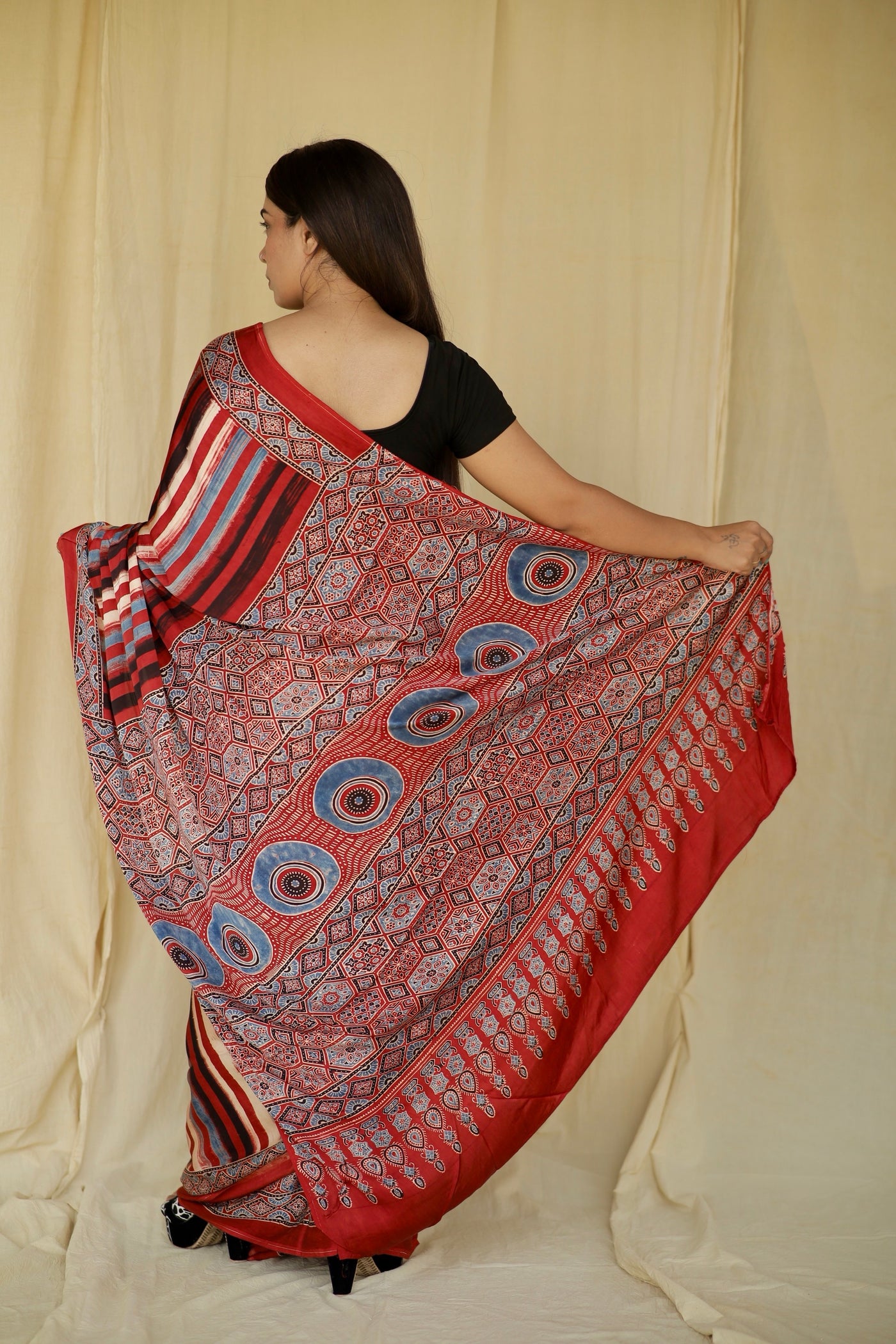 Premium multicolor striped modal silk saree with heritage-inspired Ajrakh designs and fluid texture