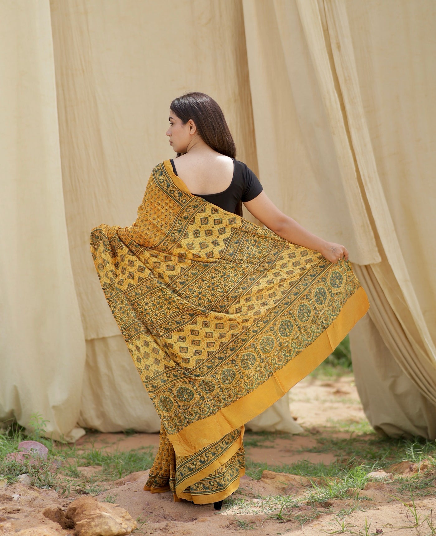 Premium mustard yellow Chanderi silk saree with heritage-inspired Ajrakh designs and subtle sheen