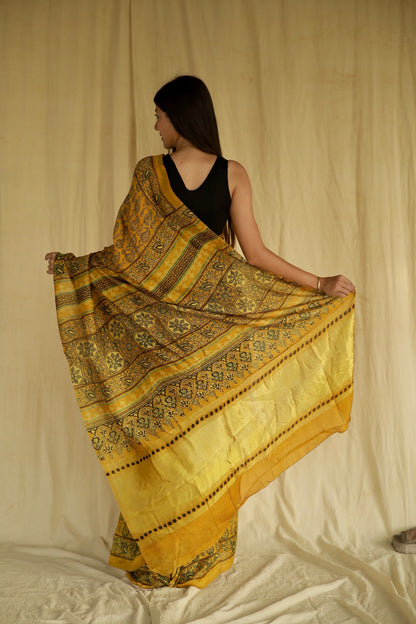 Premium olive gold Chanderi silk saree with heritage-inspired Ajrakh designs and subtle sheen
