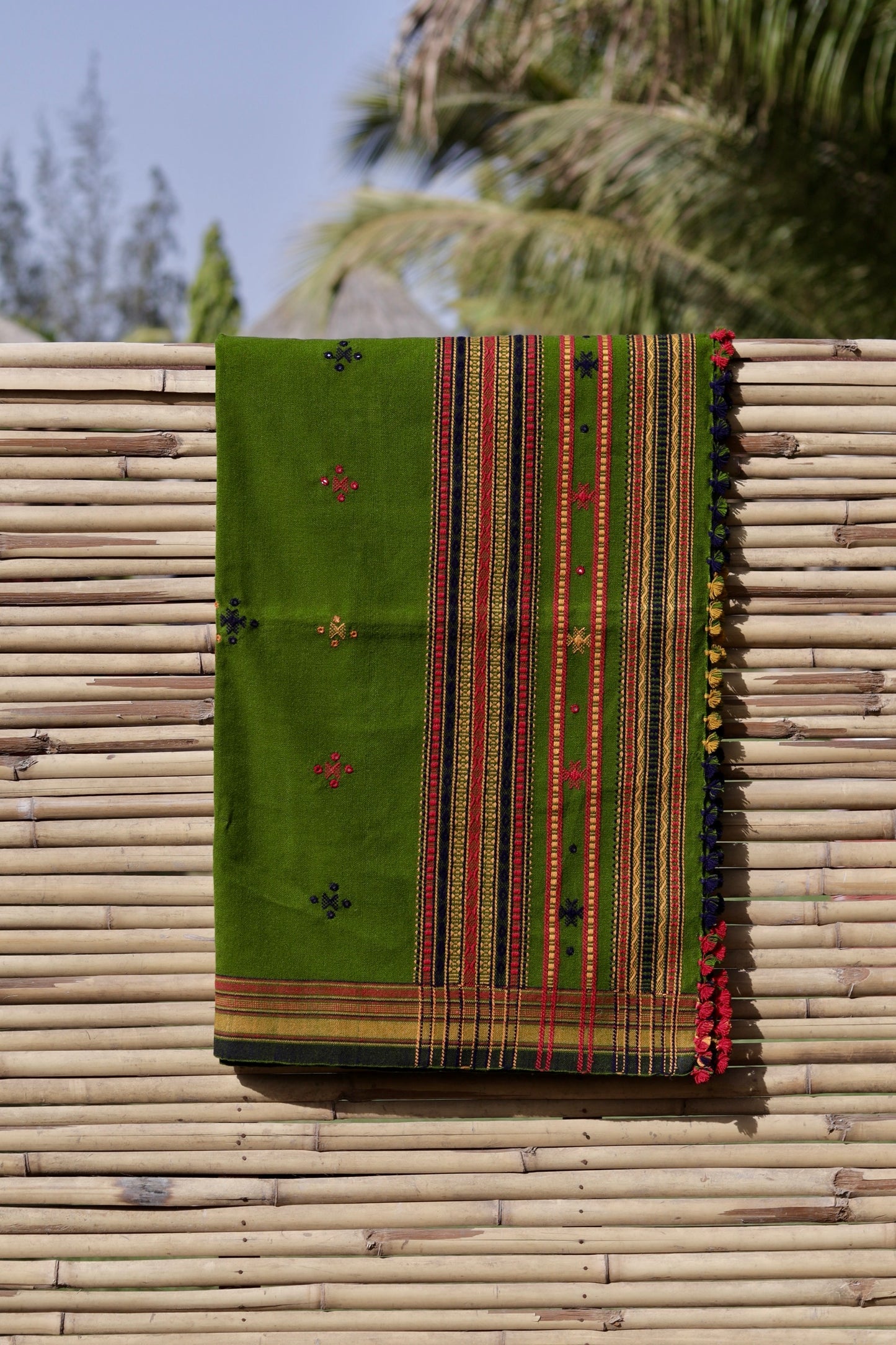 Traditional olive green wool shawl showcasing authentic weaving artistry and timeless appeal