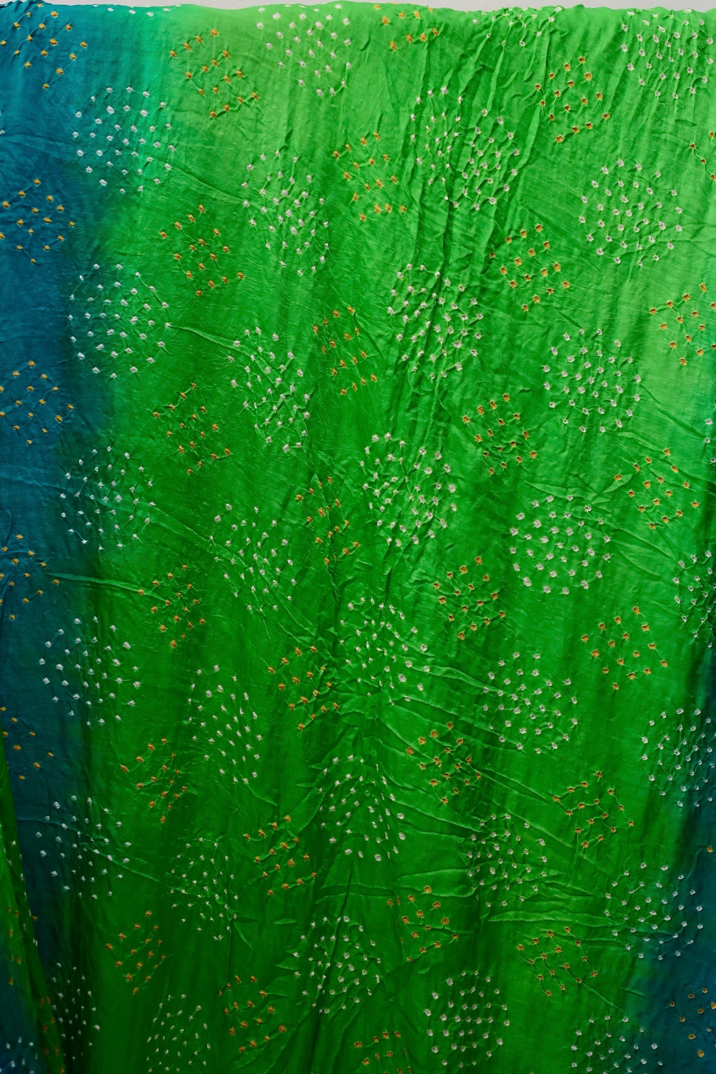 Premium peacock Bandhani Gajji silk saree highlighting fine artisan craftsmanship and festive elegance