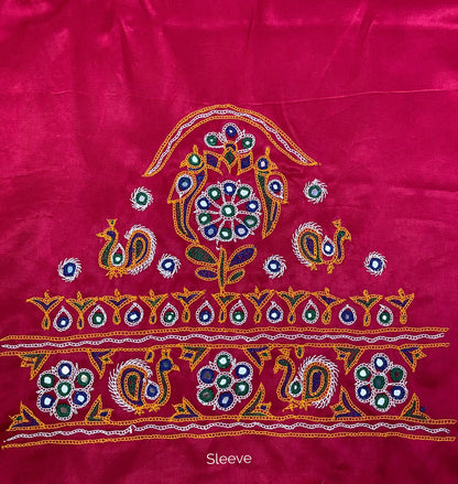 Pink Ahir embroidery blouse piece showcasing intricate handcrafted embroidery details