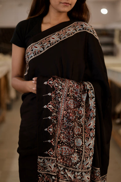 Traditional plain black Ajrakh saree crafted in luxurious modal silk for refined elegance