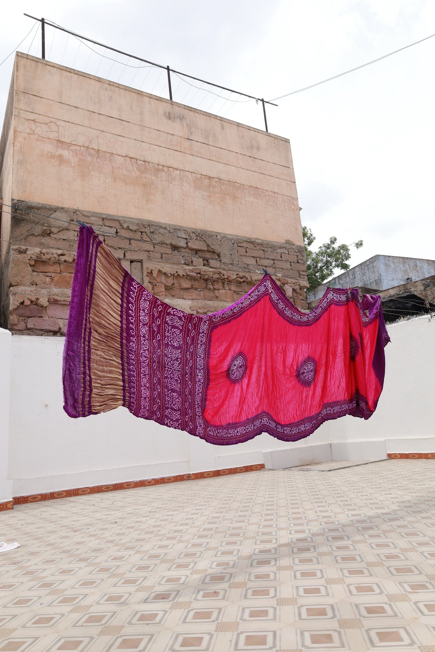 Traditional Bandhani Gajji silk saree in purple hues with a beautifully woven zari pallu