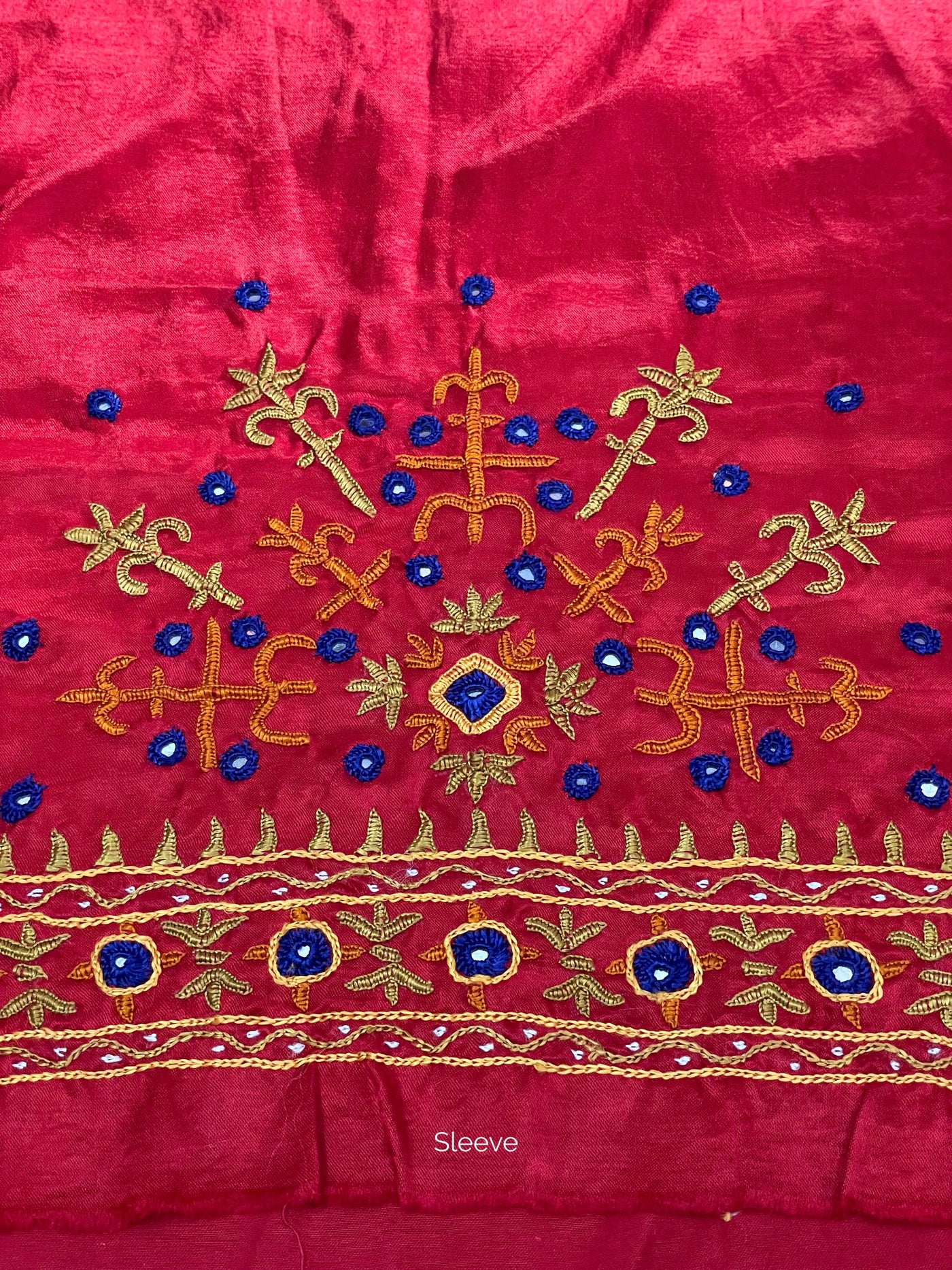 Raspberry pink Pakko embroidery blouse piece showcasing intricate handcrafted embroidery details