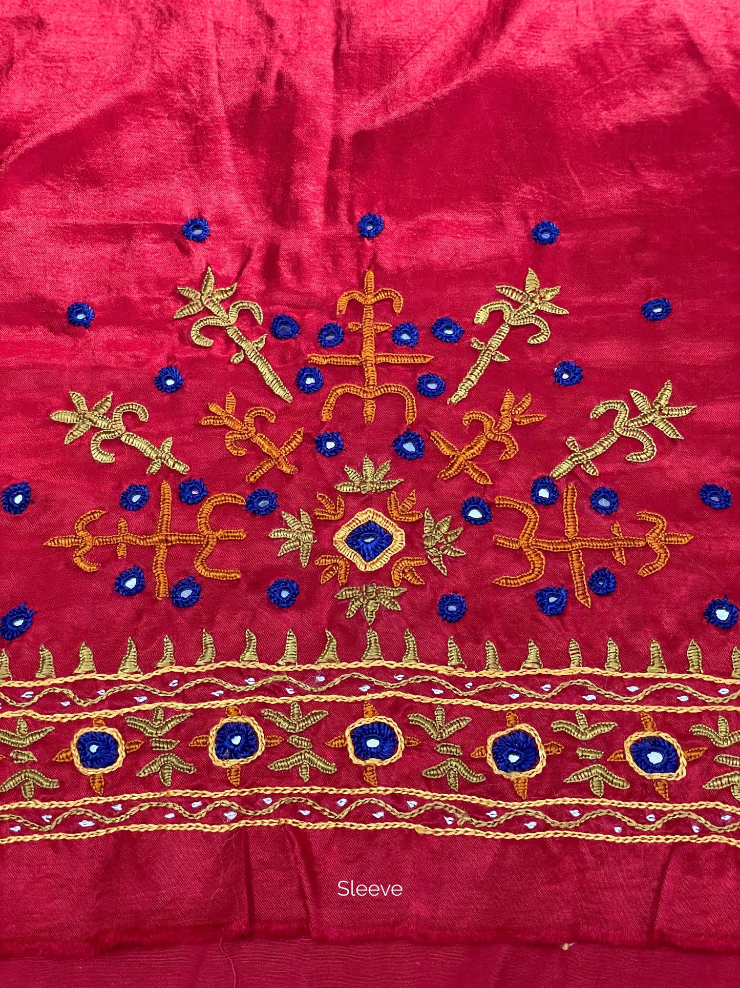 Raspberry pink Pakko embroidery blouse piece showcasing intricate handcrafted embroidery details