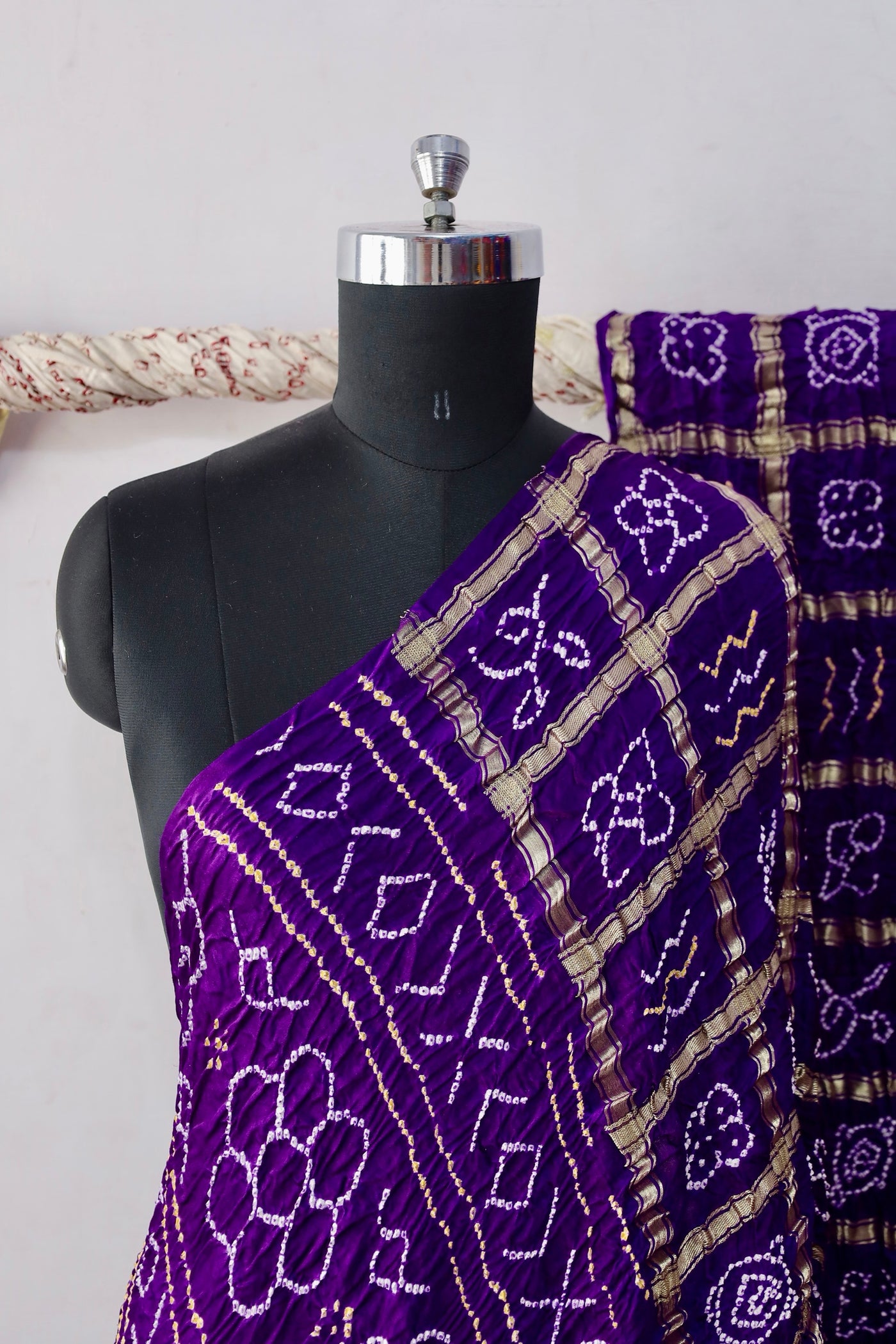 Royal Bandhani Gharchola Gajji silk saree featuring traditional tie-dye motifs and heritage-inspired checked patterns