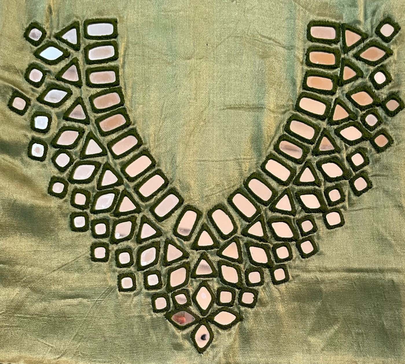 Sage green mirror work dress material showcasing intricate handcrafted embellishments