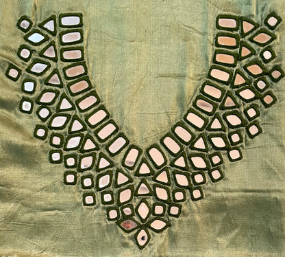 Sage green mirror work dress material showcasing intricate handcrafted embellishments