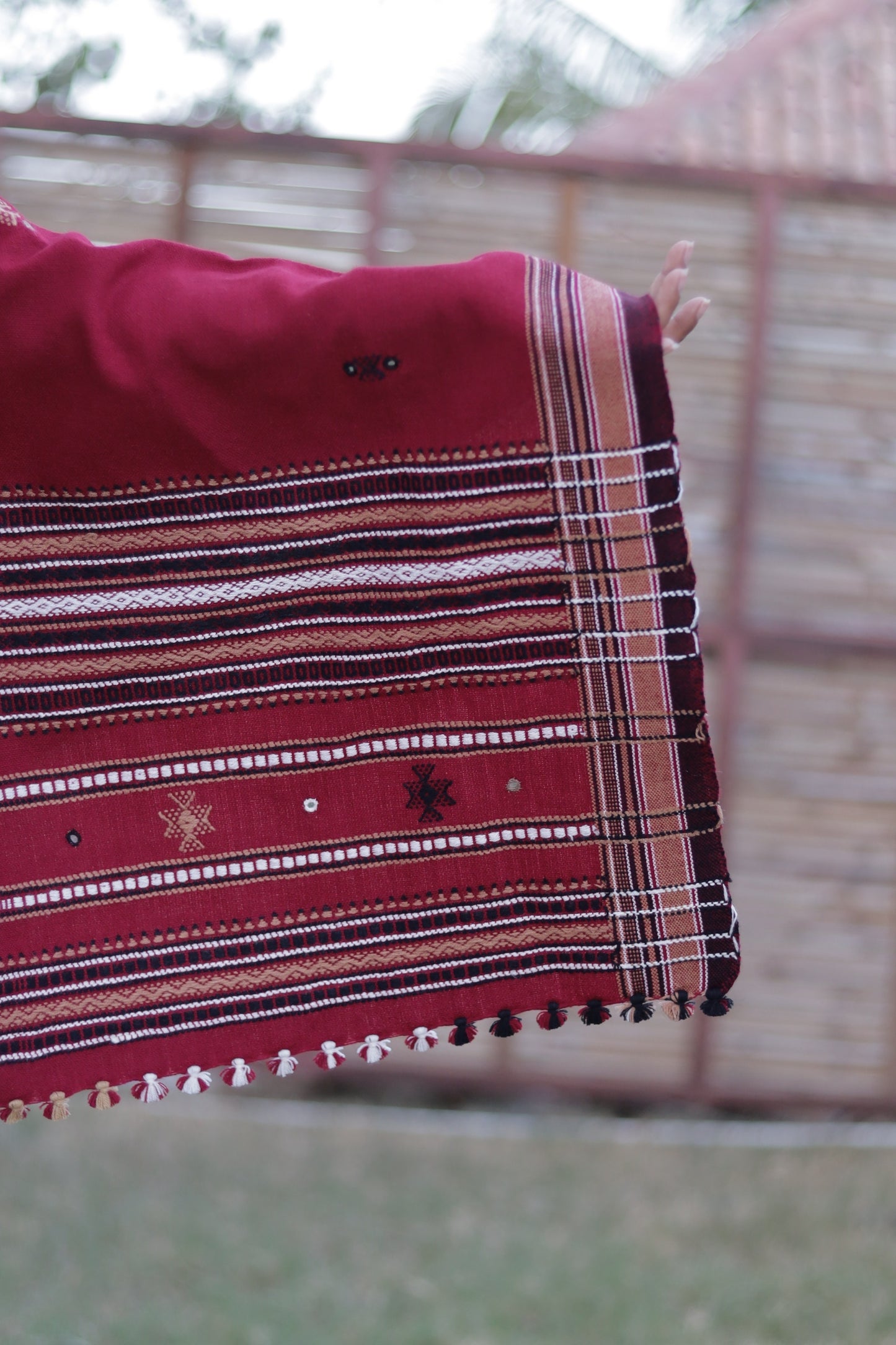 Premium handwoven woolen shawl in scarlet red with a soft texture and graceful drape