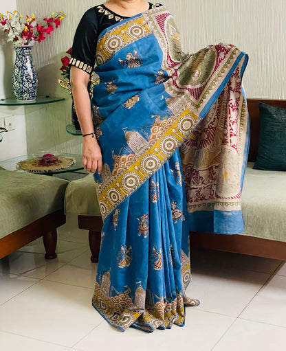Handcrafted sky gold Mata Ni Pachedi saree adorned with authentic handpainted designs inspired by Gujarat's folk art heritage