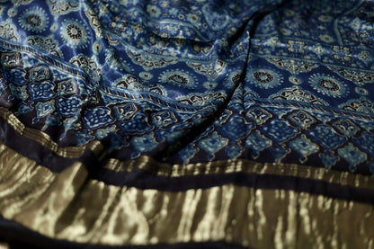 Traditional steel blue Ajrakh modal silk dupatta showcasing authentic artisan craftsmanship and decorative borders