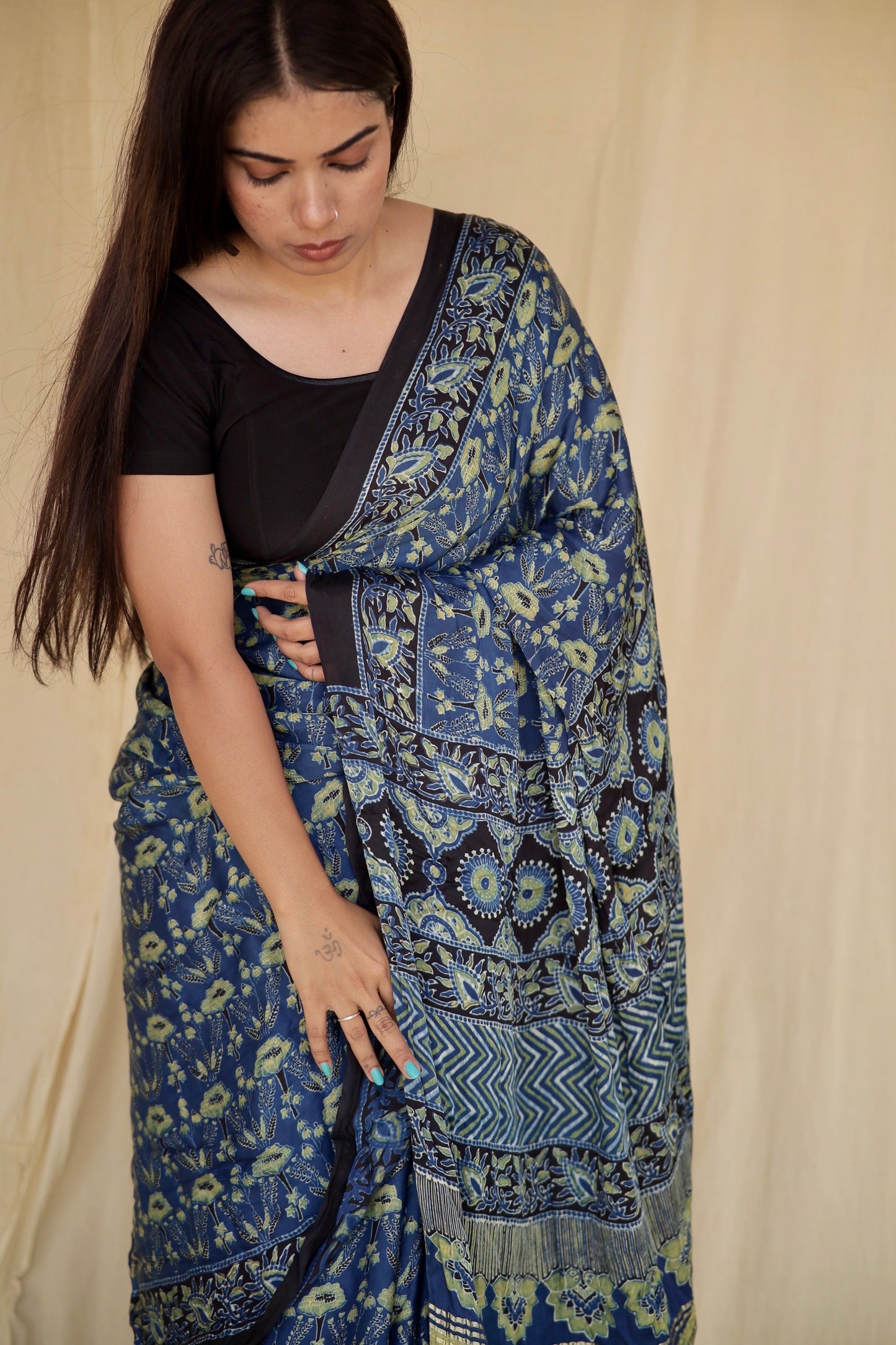 Premium steel blue modal silk saree with heritage-inspired Ajrakh designs and fluid texture