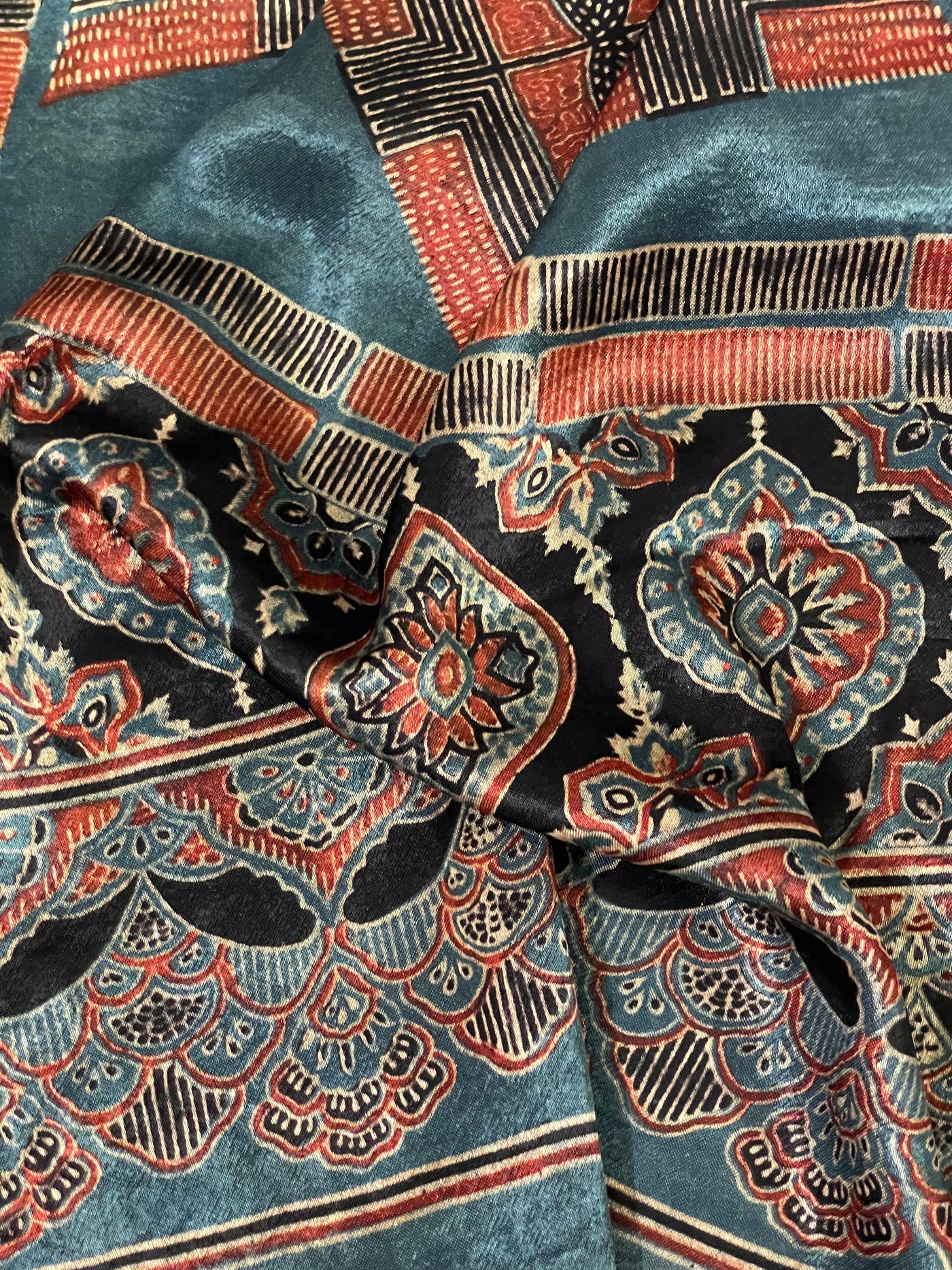 Traditional teal blue Ajrakh Mashru silk stole showcasing authentic artisan craftsmanship