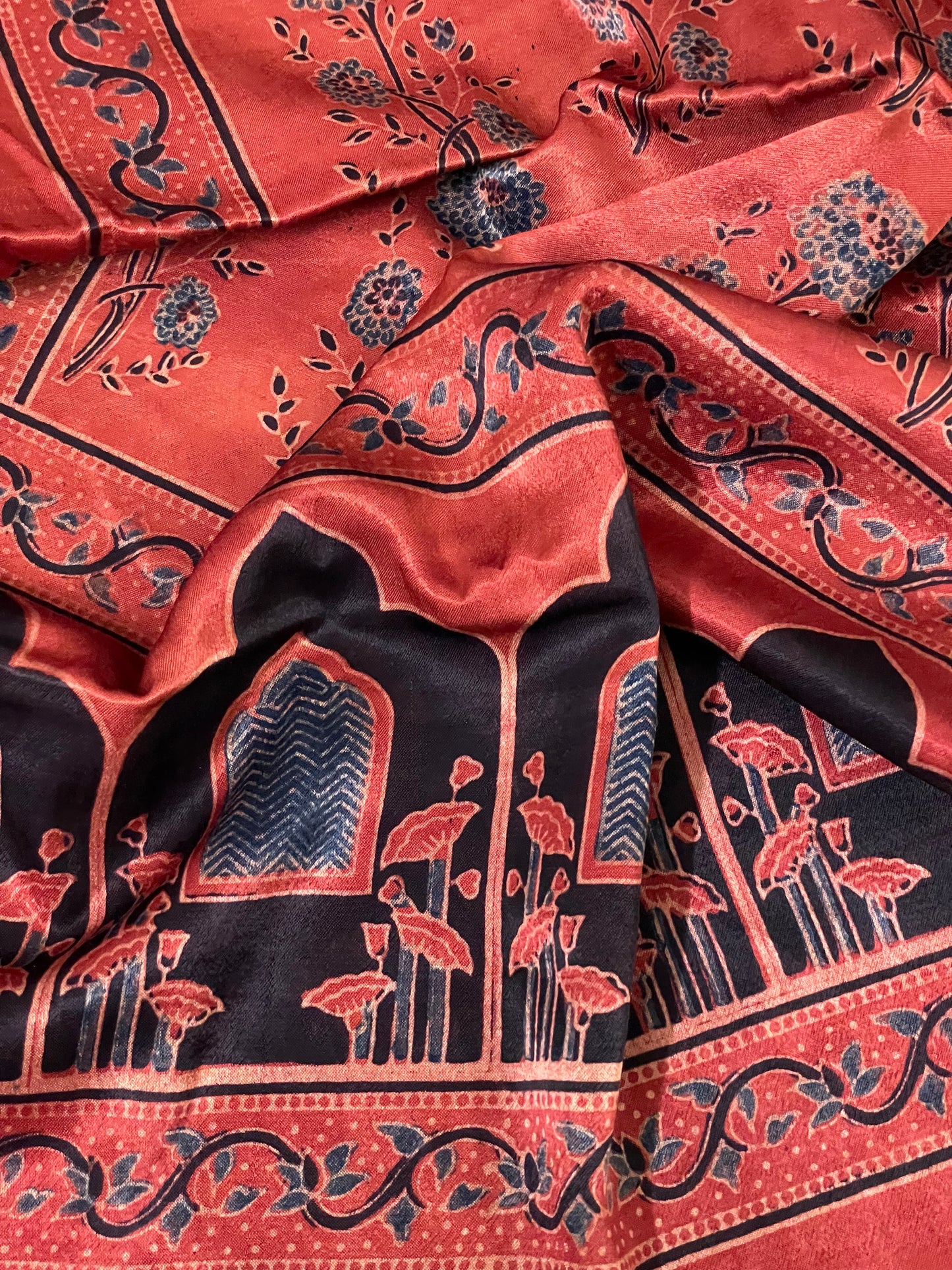 Traditional terracotta red Ajrakh Mashru silk stole showcasing authentic artisan craftsmanship