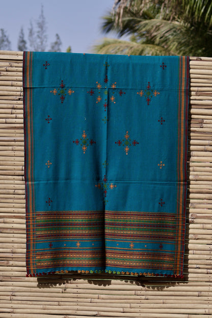 Elegant turquoise blue wool shawl handcrafted using traditional handloom weaving techniques