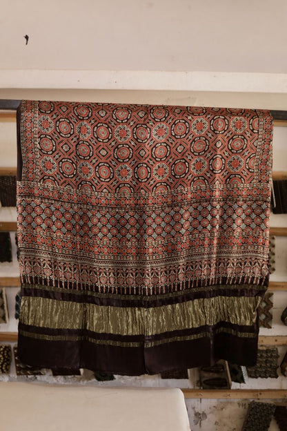 Walnut brown Ajrakh modal silk dupatta with Lagdi Patta featuring intricate block printed motifs and elegant drape