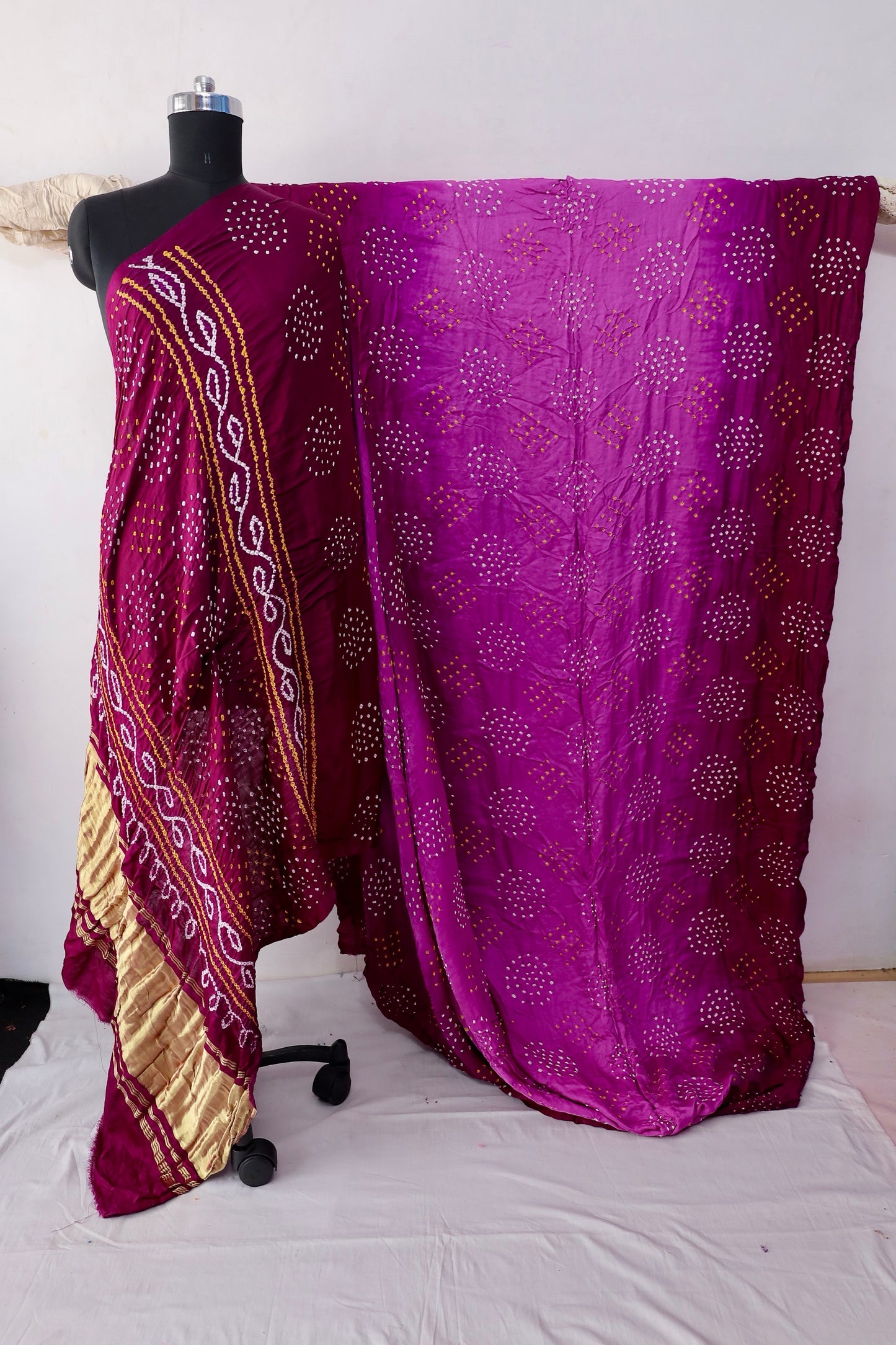 Wine Bandhani Gajji silk saree featuring intricate tie-dye patterns and an elegant zari pallu