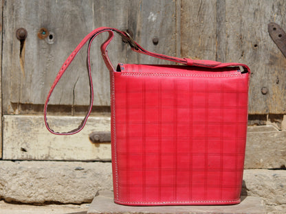 Artisan-made leather bag featuring traditional zari embroidery and fine detailing