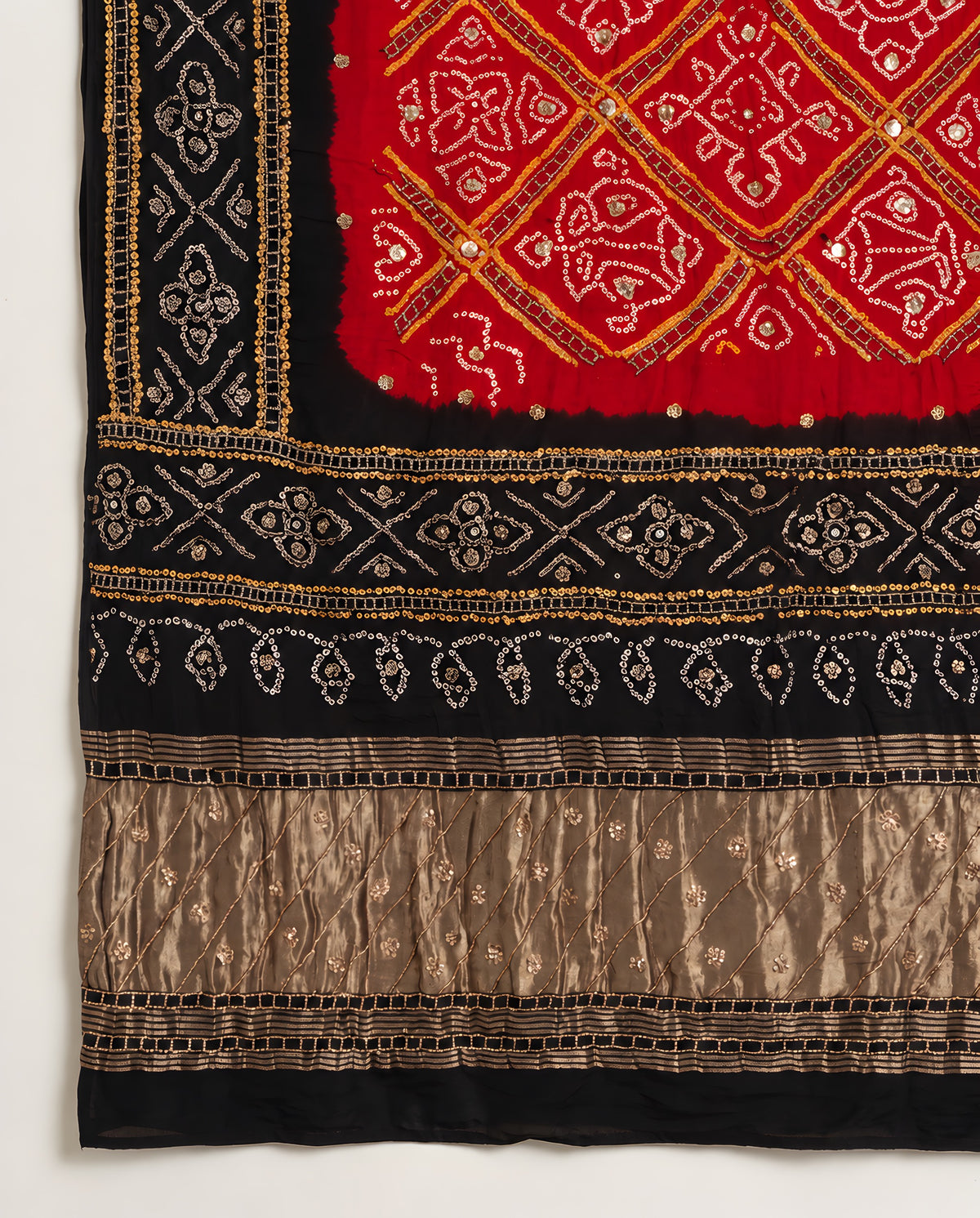Border detailing on black and red Bandhani gota patti dupatta