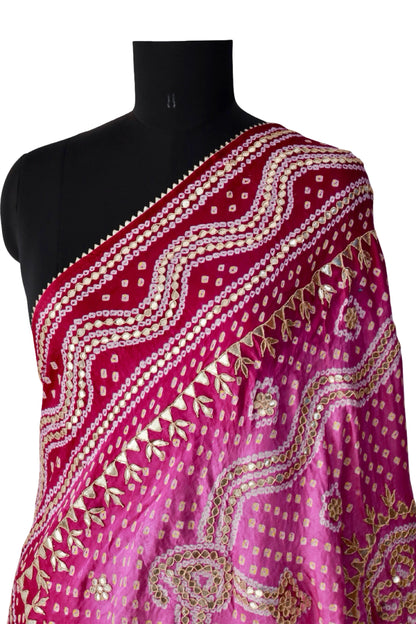 Burgundy border with flowing embellished lines on a pink silk Bandhani dupatta