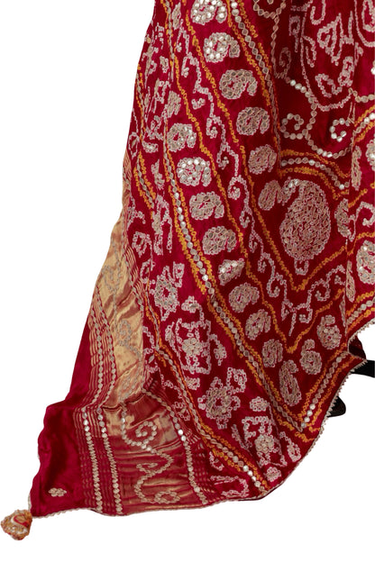 Ornate border with repeating Gota Patti motifs and narrow yellow accents on red silk
