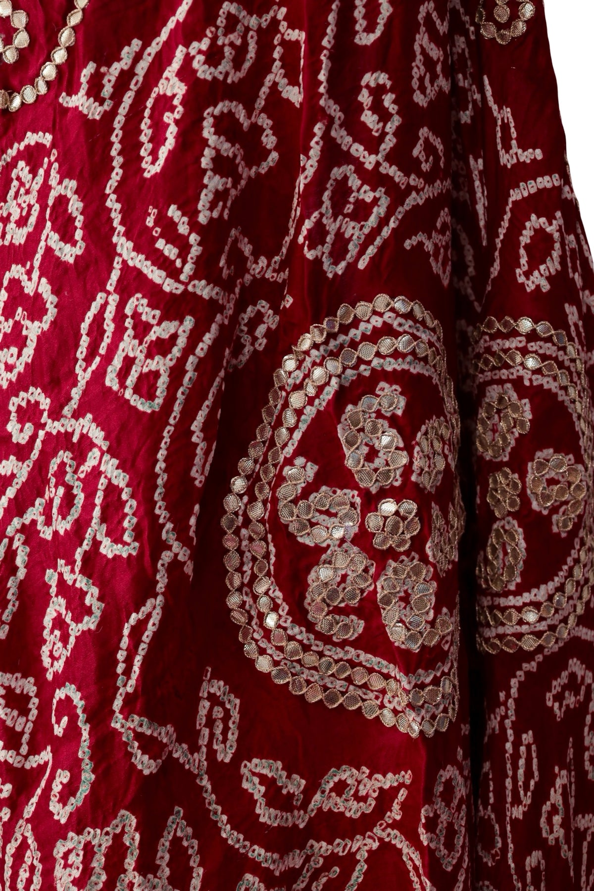 Red silk dupatta with curling Bandhani patterns and circular floral Gota Patti motifs