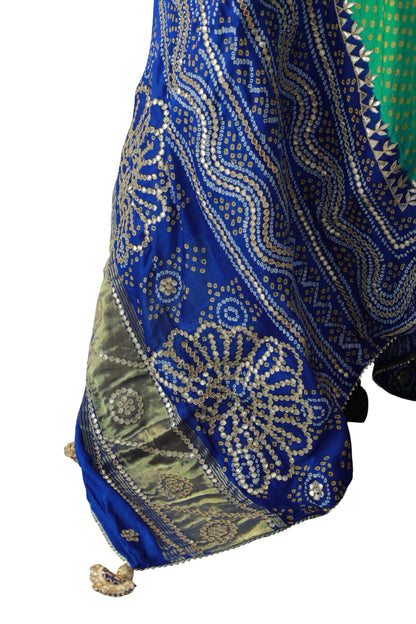 Yellow Bandhani dots and decorative Gota Patti motifs on green Gajji silk