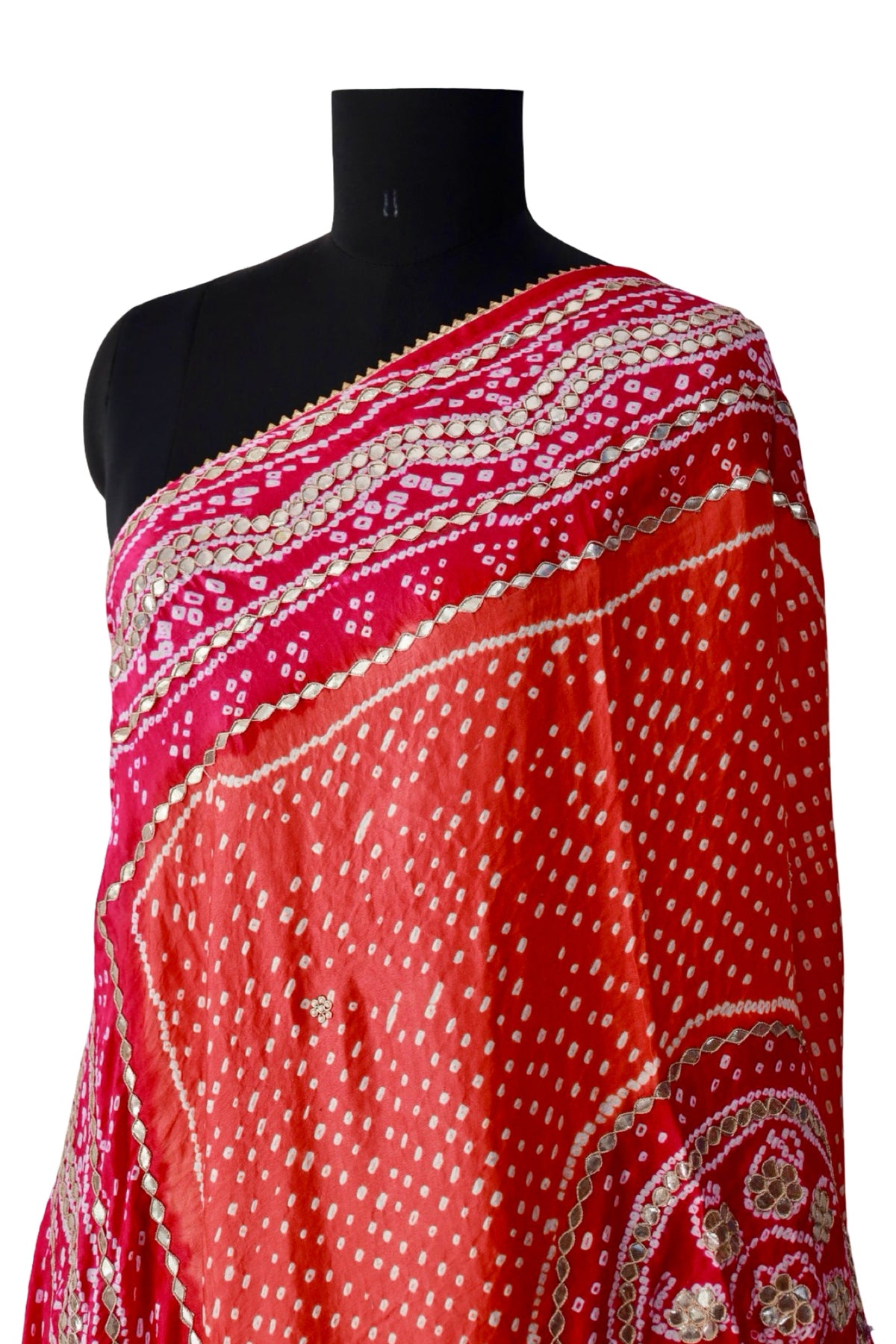 Orange silk dupatta with fine white Bandhani dots and a contrasting bright pink border