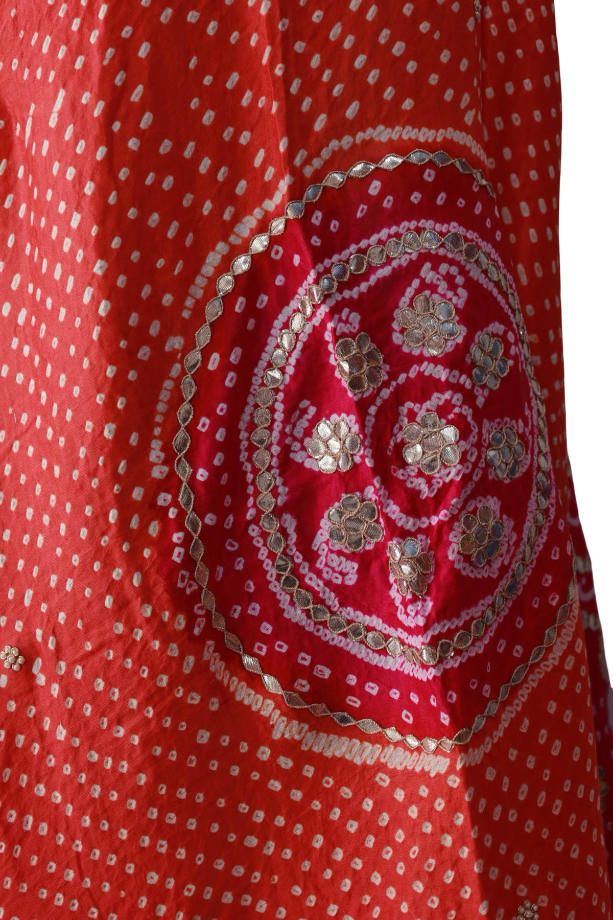 Orange silk dupatta with fine white Bandhani dots and a contrasting bright pink border